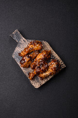 Grilled chicken wings in teriyaki sauce. Hot spicy takeaway food