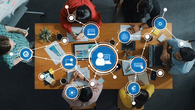Collaborative Business Meeting with Diverse Team Analyzing Data and Creating Strategies Around Central Ideas Using Digital Technology Tools. Amity - Powered by Adobe