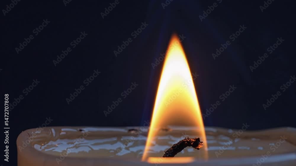 Poster soft candlelight dancing against deep darkness, emanating warmth and tranquil glow while casting sub
