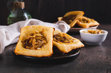 Upside down tarts with caramelized onions on a plate on a table