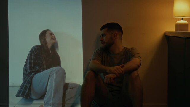 Full shot of young man missing happy moments with ex-girlfriend, recalling her smile and cheerful face, feeling loneliness and pain from breakup