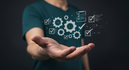 Fototapeta premium A person holding digital gears and checkmarks in their hand against a dark background, concept design