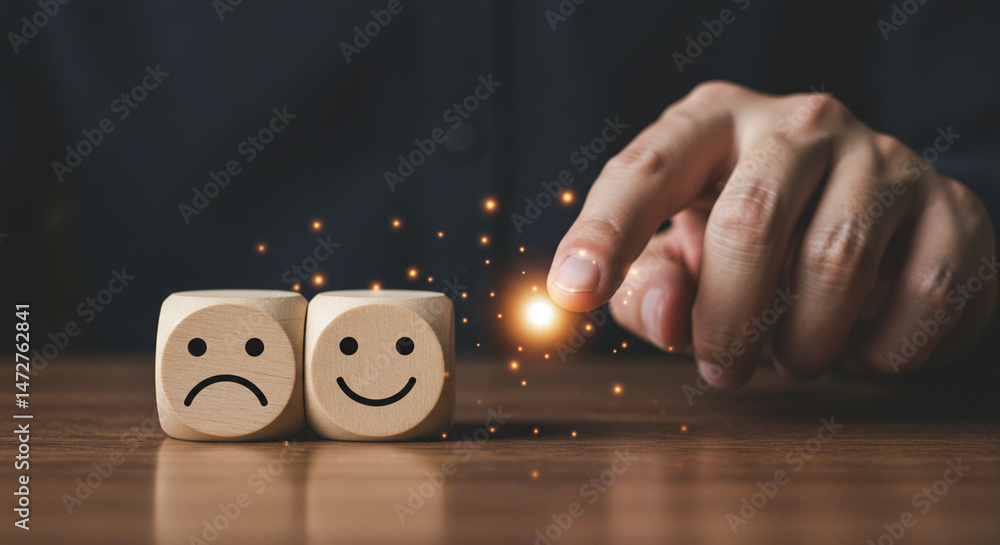 Poster a hand selecting a happy face wooden block from a sad face block on a wooden surface with sparkles