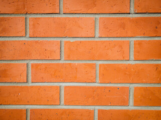 Red brick wall close-up background texture. Clinker bricks wall pattern. Wallpaper bricks texture. 