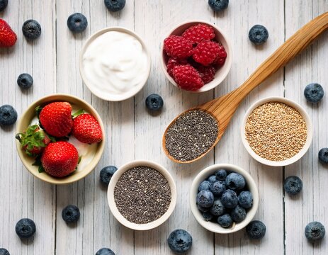 healthy gut foods flat lay for world digestive health day close up of spoon with yogurt chia seeds and berries for digestive wellness - Powered by Adobe