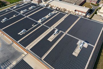Solar panels on a roof of industrial building. Aerial view