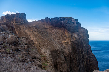 Viewpoint Calhau da Furna do Bode on Madeira, green hills meet sea, discovery archipelago landscape, volcanic island travel, adventure vacation, colorful rooftops, Madeira, Portugal
