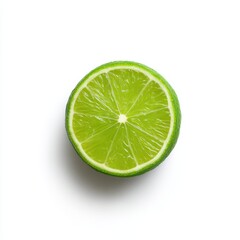 A vibrant green lime cut in half with a white backdrop showing the citrus fruit detail clearly