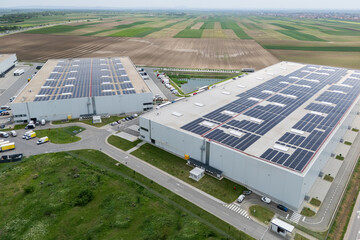 Logistics centers with solar panels on roofs. Aerial view