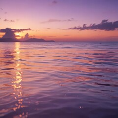 Obraz premium Blurred orange and purple sunset reflecting on a gentle ocean surface , abstract, sea