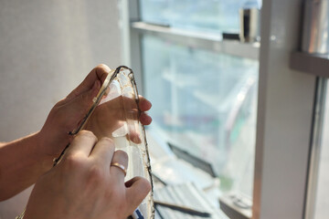 Hands actively engaged in working on advanced technology with various modern gadgets and devices