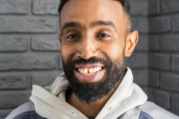 Smiling cheerful african american ethnicity man with a beard looking at camera. A happy confident...