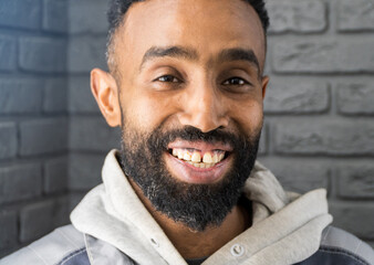 Smiling cheerful african american ethnicity man with a beard looking at camera. A happy confident...