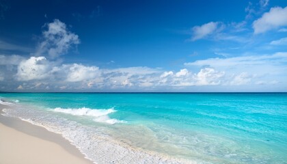 serene beach vista with turquoise waters gentle waves and scattered clouds