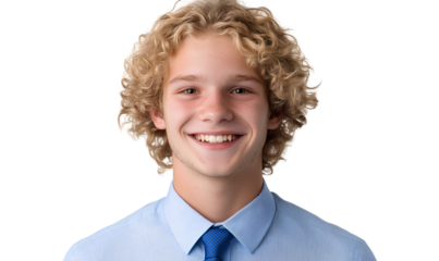  young man with curly blonde hair, wearing a blue shirt with a tie and bro