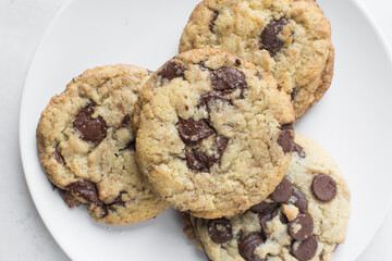 Overhead view of chocolate chip cookies, top view of homemade chocolate chip cookies on a white...