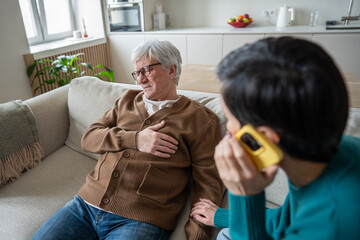 Struggling retired man in pain with chest discomfort, wife call ambulance assistance. Medical...
