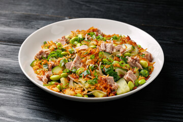 Crispy Rice Tuna Salad with edamame beans, cucumber, onion