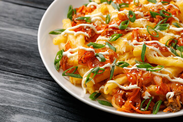 Loaded Kimchi Fries with cheese, mayonnaise and spring onion