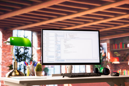 Programming code on PC display used for developing software programs. Binary script on computer at home used for fixing errors in applications and implementing new features