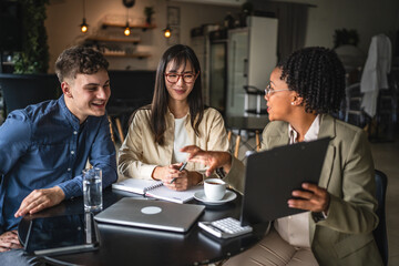 female financial adviser show finance plan to young entrepreneurs