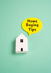 Fototapeta na wymiar House and inscription home buying tips. Guidance for first-time buyers or experienced investors includes advice on real estate research, mortgage selection, location evaluation, and budgeting.