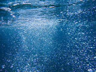 Bubbles under the sea in the crystal clear green sea water. Mediterranean bubbles. Real image very suitable for backgrounds, Rising Bubbles in Deep Underwater, Under with bubble. Great for background.