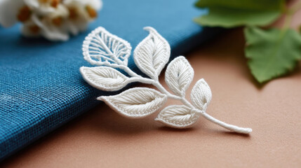 Delicate white leaf brooch design
