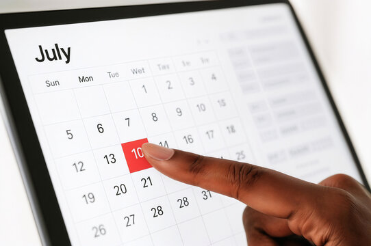 Hand pointing to July tenth highlighted on a digital calendar, marking Black Womens Equal Pay Day. Reminder of an important date for social justice, pay equity, and awareness events