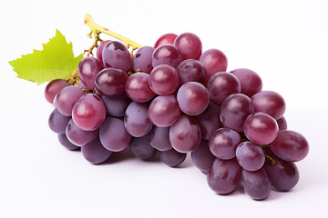 Fototapeta premium A cluster of ripe red grapes with a leaf, isolated on white