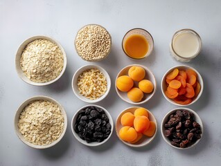 Aesthetic Arrangement of Healthy Grains, Dried Fruits, and Smoothies in Bowls on Light Gray Surface for Culinary and Dietary Inspiration