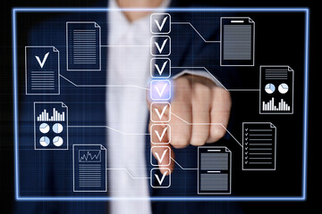 Business woman approving documents on virtual screen against black background, closeup