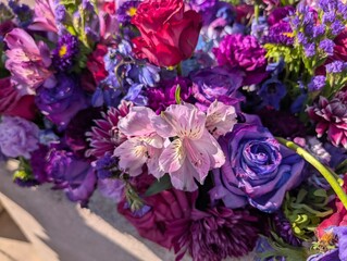 Vibrant Floral Arrangement with Purple, Pink, and Red Blossoms