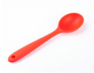 Red cooking utensil; rounded spoon with small hole on handle end, placed atop white surface