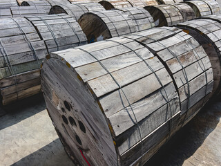 A pile of electrical wire rolls is laid out on the floor.