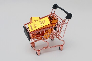 Pile of gold bars in a shopping cart
