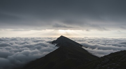 Majestic Mountain Peak Above a Sea of Clouds at Sunrise