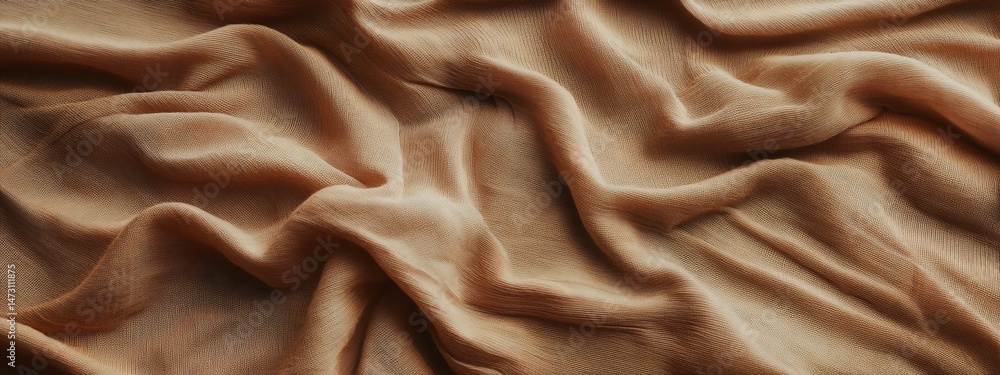Poster abstract image of draped light brown fabric with soft folds and wrinkles.