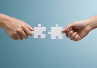 Hands holding two puzzle pieces on a blue background, ready to connect