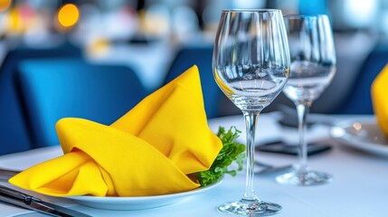 Elegant Dinner Table Setting with Yellow Napkin and Glassware