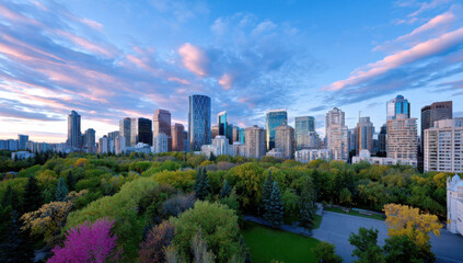 Obraz premium Calgary skyline at sunset, showcasing modern architecture amidst lush autumnal parkland. The vibrant colors of the sky and foliage create a stunning urban landscape. : Generative AI