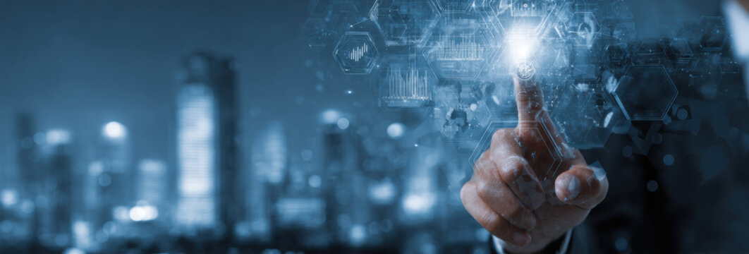 A hand interacts with a futuristic digital interface, showcasing data visualizations and global network connections against a blurred cityscape backdrop at night. : Generative AI