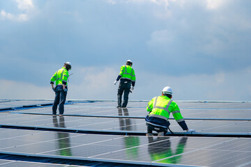 Engineer team installs solar cells check installation solar cell on the roof Sustainable energy industry concept Renewable energy solutions for climate change..