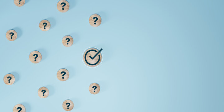 Questions and a check mark on the wooden with words. many questions and one answer.