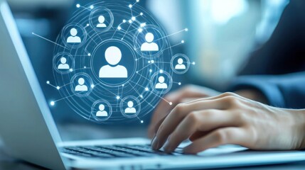 A person submitting a job application via email on a laptop