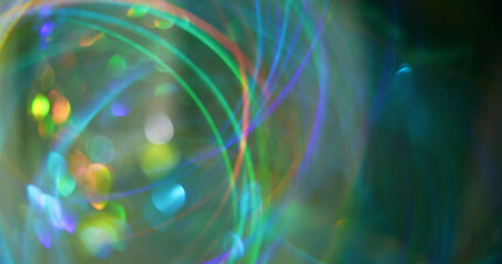 Blur glow. Defocused shiny flare. Gleaming green yellow multicolored circles lens on bokeh light...