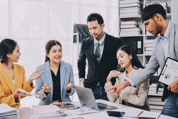 Team of financial advisory services. Asian advisor showing plan of investment to clients in the consultancy office..