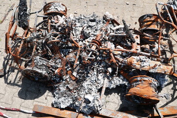 A car is on fire and has been destroyed