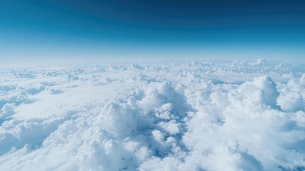Expansive view of a boundless, fluffy cloud sea under a vibrant blue sky