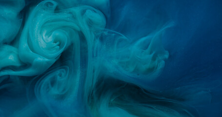 Fototapeta premium Acrylic fluid. Drop ink. Defocused blue color cloud paint texture in water mix chemical liquid floating on creative art background.